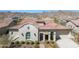 Charming single-story home with desert landscaping, tile roof, and mountain views at 5142 N 205Th Gln, Buckeye, AZ 85396