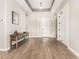 Inviting entryway featuring tile floors, neutral walls, a console table, and a white front door with sidelights at 5700 N 202Nd Ln, Litchfield Park, AZ 85340