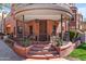 Inviting entrance with curved porch, brick detailing, and landscaped garden at 605 S Roosevelt St, Tempe, AZ 85281