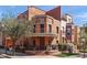 Charming multi-story townhome with brick facade, unique architectural details, and a welcoming front porch and manicured landscaping at 605 S Roosevelt St, Tempe, AZ 85281