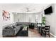 Inviting living area featuring stylish gray sofa and a modern ceiling fan at 605 S Roosevelt St, Tempe, AZ 85281