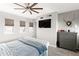 Comfortable main bedroom with plush carpeting, ample natural light, and a modern ceiling fan at 605 S Roosevelt St, Tempe, AZ 85281