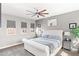 Serene main bedroom featuring plush carpeting, large windows, and neutral color palette at 605 S Roosevelt St, Tempe, AZ 85281