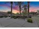 Community park featuring mature palm trees, seating, and a covered gazebo at sunset at 610 W Tonto Dr, Chandler, AZ 85248