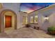 Inviting courtyard with stone pavers, front door, and ambient lighting at 610 W Tonto Dr, Chandler, AZ 85248