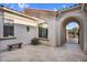 Private courtyard featuring stone flooring, a bench, and access to a gated entrance at 610 W Tonto Dr, Chandler, AZ 85248