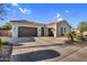 Beautiful single-story home featuring a three-car garage, tile roof, and a well-maintained yard at 610 W Tonto Dr, Chandler, AZ 85248