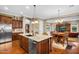 Open layout showcasing the kitchen island with seating and adjacent breakfast nook and living area at 610 W Tonto Dr, Chandler, AZ 85248