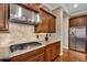 Spacious kitchen featuring granite countertops, stainless steel appliances, and wood cabinetry at 610 W Tonto Dr, Chandler, AZ 85248