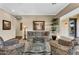 Inviting living room with elegant glass table, neutral paint, and comfortable seating arrangement at 610 W Tonto Dr, Chandler, AZ 85248