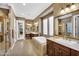 Luxurious main bathroom featuring dual sinks, a soaking tub, a separate shower, and decorative tile at 610 W Tonto Dr, Chandler, AZ 85248