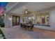 Outdoor patio with an ornate dining table and six chairs beneath a covered patio area, perfect for relaxing at 610 W Tonto Dr, Chandler, AZ 85248