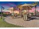 Well-maintained playground with sunshades, slides, and various play structures for entertainment at 610 W Tonto Dr, Chandler, AZ 85248