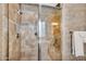 Walk-in shower with seating, a glass enclosure, a shower head, and tile surround at 610 W Tonto Dr, Chandler, AZ 85248