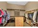 Organized walk-in closet with shelves and hanging space for clothes and shoes at 610 W Tonto Dr, Chandler, AZ 85248