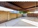 Spacious covered patio with concrete flooring, ideal for outdoor entertaining and relaxation at 6338 E Camelot Dr, Mesa, AZ 85215