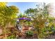 Charming backyard patio featuring a cozy seating area, lush greenery, and a tranquil ambiance at 6338 E Camelot Dr, Mesa, AZ 85215