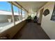 Enclosed porch with seating area and view of the outdoors, providing a relaxing space at 7300 N 51St Ave # G142, Glendale, AZ 85301