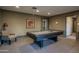 Amenity center billiards room featuring full-size pool table, seating, and artwork at 7350 N Via Paseo Del Sur -- # N108, Scottsdale, AZ 85258