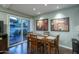 Charming dining area featuring a wooden table, stylish chairs, and a view of the outdoor patio at 7350 N Via Paseo Del Sur -- # N108, Scottsdale, AZ 85258