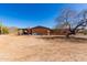 Backyard featuring a charming single-story home with desert landscaping and a spiral staircase at 765 S Geronimo Rd, Apache Junction, AZ 85119