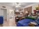 Bedroom with a view of the en suite bathroom, comfortable bed, ceiling fan, and plenty of storage at 765 S Geronimo Rd, Apache Junction, AZ 85119