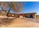 Charming brick home with a large tree in the front yard at 765 S Geronimo Rd, Apache Junction, AZ 85119