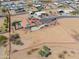 Aerial view of a property with a fenced perimeter, a pool, desert landscaping, and neighborhood at 8715 S Valley Vista Ct, Casa Grande, AZ 85193