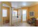 Bright bathroom featuring a jacuzzi tub, glass enclosed shower, and decorative accents at 8715 S Valley Vista Ct, Casa Grande, AZ 85193