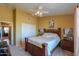 A bedroom featuring a bed, carpet, and closet doors, with an open doorway leading to the hall at 8715 S Valley Vista Ct, Casa Grande, AZ 85193