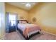 Bright bedroom featuring plush carpet, a ceiling fan, and warm paint tones, creating a cozy atmosphere at 8715 S Valley Vista Ct, Casa Grande, AZ 85193