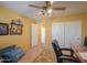 Bright bedroom featuring a ceiling fan, decorative pillows, and neutral color scheme at 8715 S Valley Vista Ct, Casa Grande, AZ 85193