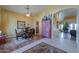 Spacious dining room with elegant furnishings, wood flooring, and a ceiling fan at 8715 S Valley Vista Ct, Casa Grande, AZ 85193