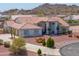 Stunning desert home features a large, attached two-car garage and circle driveway at 8715 S Valley Vista Ct, Casa Grande, AZ 85193