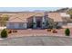 Charming single-story home with desert landscaping and mountain views in the distance at 8715 S Valley Vista Ct, Casa Grande, AZ 85193