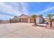 Spacious garage with two doors, beautiful pavers, and desert landscaping at 8715 S Valley Vista Ct, Casa Grande, AZ 85193