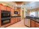 Well-equipped kitchen features granite countertops, stainless steel appliances, and ample cabinet space at 8715 S Valley Vista Ct, Casa Grande, AZ 85193