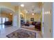 Inviting living room features a beautiful fireplace, tile floors, and arched doorways at 8715 S Valley Vista Ct, Casa Grande, AZ 85193