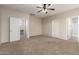 Spacious carpeted bedroom featuring neutral walls and bright natural light at 924 E Redondo Dr, Gilbert, AZ 85296