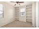 Carpeted bedroom with built-in shelves and natural light from a window at 924 E Redondo Dr, Gilbert, AZ 85296