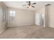 Spacious bedroom with neutral walls, plush carpet, and a ceiling fan at 924 E Redondo Dr, Gilbert, AZ 85296