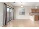 Inviting dining area with tile flooring, sliding glass door and modern light fixture at 924 E Redondo Dr, Gilbert, AZ 85296