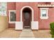 Covered front entrance with stucco, walkway, and front yard landscaping at 924 E Redondo Dr, Gilbert, AZ 85296