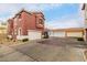 View of a terracotta home with a two-car garage and plenty of parking space at 924 E Redondo Dr, Gilbert, AZ 85296