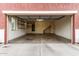 Spacious two-car garage with overhead storage and shelving at 924 E Redondo Dr, Gilbert, AZ 85296