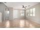 Bright living room with tile flooring, ceiling fan and lots of natural light from the windows at 924 E Redondo Dr, Gilbert, AZ 85296