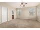 Spacious carpeted main bedroom with natural light and en suite bathroom at 924 E Redondo Dr, Gilbert, AZ 85296