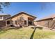 View of home's backyard with block fence at 9423 E Posada Ave, Mesa, AZ 85212