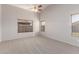 Vaulted-ceiling bedroom with natural light from multiple windows, creating a bright and welcoming retreat at 9423 E Posada Ave, Mesa, AZ 85212