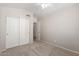 Neutral bedroom features closet, ceiling fan and tan carpet at 9423 E Posada Ave, Mesa, AZ 85212